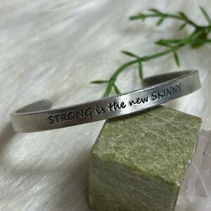 Strong is the new skinny silver tone Bangle Bracelet
